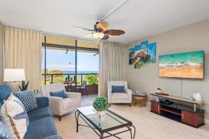 a living room with a couch and a table at Kahana Villa F405 · KV F405 Perfect Maui Getaway Condo w Ocean V in Kahana