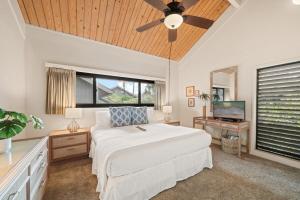 a bedroom with a bed and a ceiling fan at Kahana Village 26 · KHV 26 2BD Direct Ocean Front with Amazing S in Kahana +52 photos