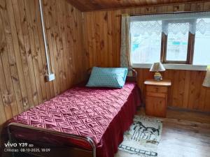 Ένα ή περισσότερα κρεβάτια σε δωμάτιο στο Hospedaje Mirador del Puerto