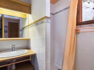 a bathroom with a sink and a mirror at Appartement cosy 2 pièces avec wifi à Méribel - FR-1-180-663 in Chandon +7 photos