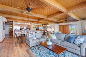 a living room with a couch and a table at Kahana Outrigger 3A2 · KHO 3A2 Updated OceanFront 3BD wPool AC O in Kahana