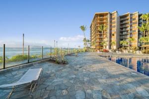 a resort with a swimming pool and a resort at Kaanapali Shores 548 in Kahana