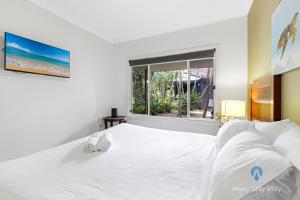 Un pat sau paturi într-o cameră la Diggers Beach Retreat