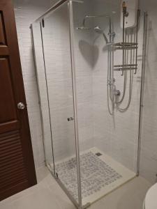 a shower stall with a glass door in a bathroom at Condo Baan klang Hua Hin city center in Hua Hin +10 photos