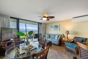 a living room with a couch and a table at Papakea L101 · PK L101 Maui Ground-Floor Condo with Ocean Views in Honokowai