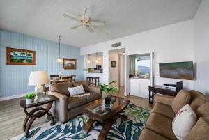 a living room with two couches and a table at Lahaina Shores PH1 · LS PH1 Oceanfront Penthouse Condo w Panoram in Lahaina