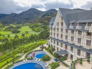 an aerial view of a resort with a pool at Swiss-Belresort Tuyen Lam in Da Lat +147 photos