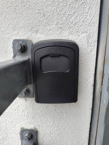 a black door latch on a white wall at Comfortable apartment with pool and wifi in Puerto Vallarta