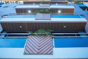 a group of buildings with plants on the roofs at Avelida Homes by RedDoorz in Iloilo City