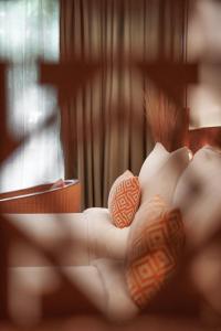 two seashells sitting on top of a bed at FCC Angkor by Avani in Siem Reap