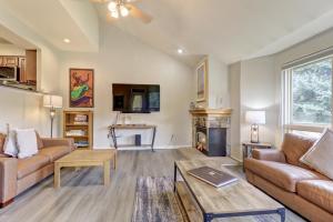 a living room with a couch and a fireplace at Legends 11 townhouse in Wheeler Junction