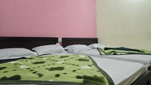 Ένα ή περισσότερα κρεβάτια σε δωμάτιο στο Hk Guest house