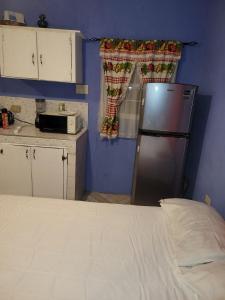 Η κουζίνα ή μικρή κουζίνα στο Val's House with private parking +26 φωτογραφίες