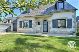 a house with a green lawn in front of it at Ker wan in Plérin