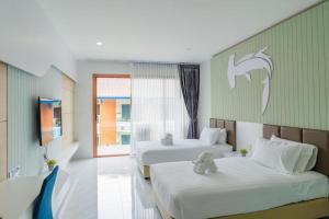 Voodi või voodid majutusasutuse The Bed Vacation Rajamangala Hotel toas +210 fotot