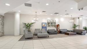 a waiting room with couches and chairs at Allure in Ettalong Beach