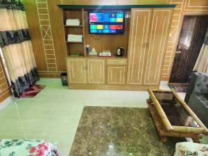 a living room with a couch and a tv at Mukta Nagar Resort in Pitua +103 photos