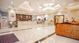a large room with a large bed in a store at Vienna Hotel Tongliao Ke'erqin in Tongliao