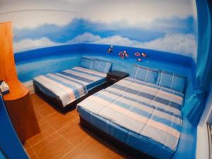 Postel nebo postele na pokoji v ubytování 海六KaKa Hostel 蘭嶼 Lanyu