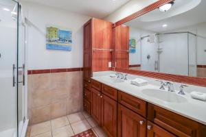 a bathroom with a sink and a shower at The Vue 233 in Tybee Island +25 photos