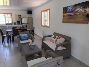 a living room with a couch and a table at Ketlina Village Grandpas House in Jacob +16 photos