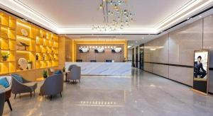 a lobby with a meeting room and a table and chairs at Green Tree Inn Zhuhai International Airport Huafa Shangdu in Zhuhai +171 photos