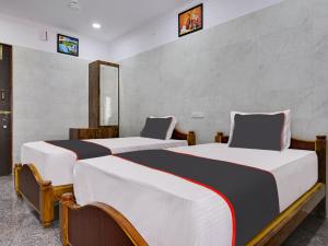 Ένα ή περισσότερα κρεβάτια σε δωμάτιο στο Hotel O AVR residency