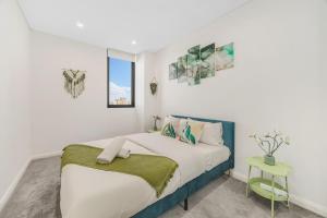 Ένα ή περισσότερα κρεβάτια σε δωμάτιο στο Liverpool 2 bedroom apartment with convenient transportation and surrounded by food
