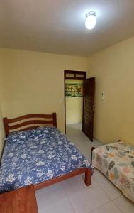 a bedroom with a bed and a door to a hallway at Casa de praia em Maria Farinhaa - Paulista in Paulista +21 photos