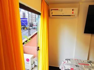 Et tv og/eller underholdning på Apê Surpreendente no Coração da Cidade