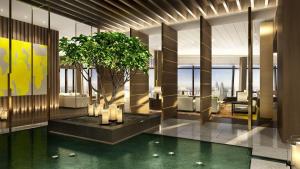 クアラルンプールにあるPark Hyatt Kuala Lumpurの木と水のプールがあるロビー