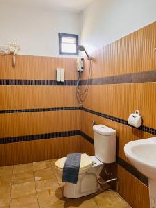a bathroom with a toilet and a sink at Lanta Nesta Resort in Ko Lanta Yai +24 photos