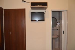 En TV eller et underholdningssystem på Hotel Aeroporto de Congonhas