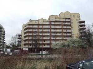 a large apartment building with a lot of windows at GreenApartament in Krakow
