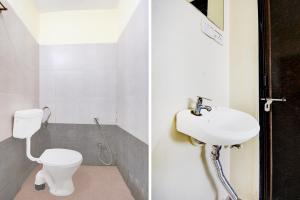 a bathroom with a toilet and a sink at Super Hotel O Hinjewadi Kirti Classic Gate in Pune