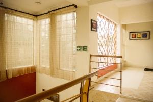 Кровать или кровати в номере Raelene Courts Luxury Apartments