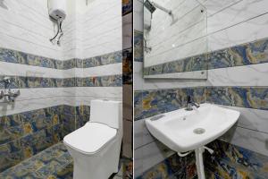 a bathroom with a toilet and a sink at Collection O Adibatla X Road, Near TCS, Wonderla Road in Ibrāhīmpatan
