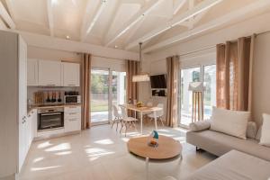 a living room with a couch and a table at White Villas in Dhounaíika