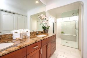 a bathroom with two sinks and a large mirror at Kapalua Bay Villas 2 Free Rental Cars KBM Resorts 180 Degree Views 2 Units 2 Bedrooms ML-1531 in Honokahua +27 photos