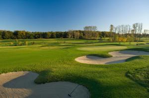 an aerial view of a golf course with a hazard at Castello Apartments in Lüneburg