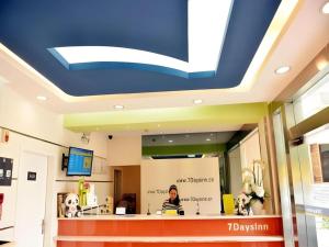 a hospital lobby with a large blue ceiling at 7 Days Inn Chengdu Sichuan University South Railway Station in Chengdu
