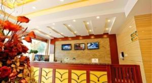 a lobby with a bar in a building at GreenTree Inn Yangzhou Slender West Lake Wencheng Attic Express Hotel in Yangzhou