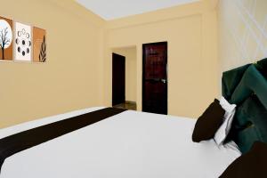 Postel nebo postele na pokoji v ubytování Hotel O Vatika + 17 fotografií