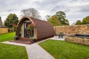 a small house with a pitched roof at Westfield House in Gargrave