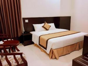 Postel nebo postele na pokoji v ubytování LUCKY STAR HOTEL