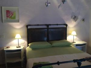 A bed or beds in a room at Il Gallo Del Vicino