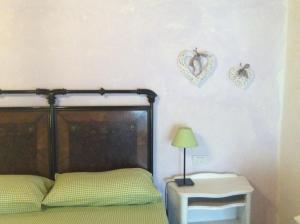 A bed or beds in a room at Il Gallo Del Vicino