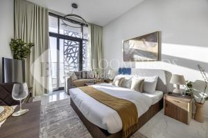 a bedroom with a king sized bed and a couch at Bloomfields Casual Stu in The Gate in Abu Dhabi +7 photos
