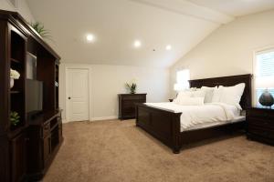 a bedroom with a large bed and a television at Destination #08 in Anaheim +21 photos
