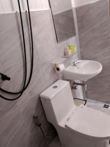 a bathroom with a toilet and a sink at The white resort & restaurant koh yao yai in Ban Khlong Hia +24 photos